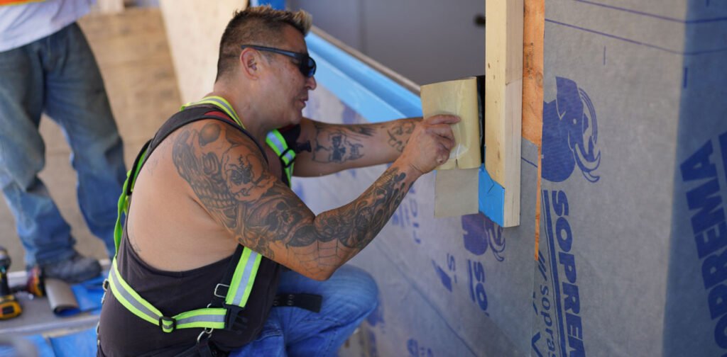 Man working on a house